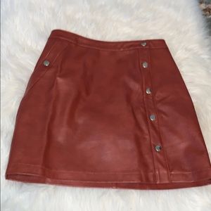 Urban Outfitters fake leather button mini skirt